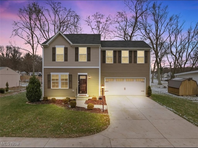 view of front of house with a garage and a lawn