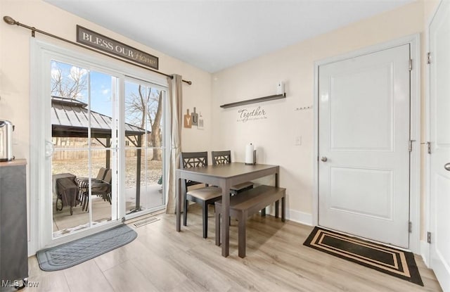 dining space featuring light hardwood / wood-style flooring