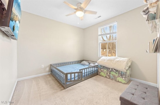 carpeted bedroom featuring ceiling fan