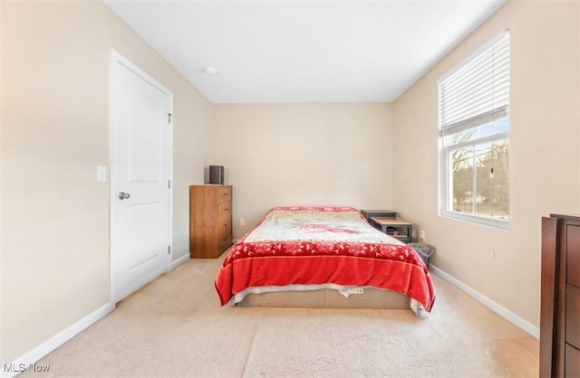 bedroom with light colored carpet