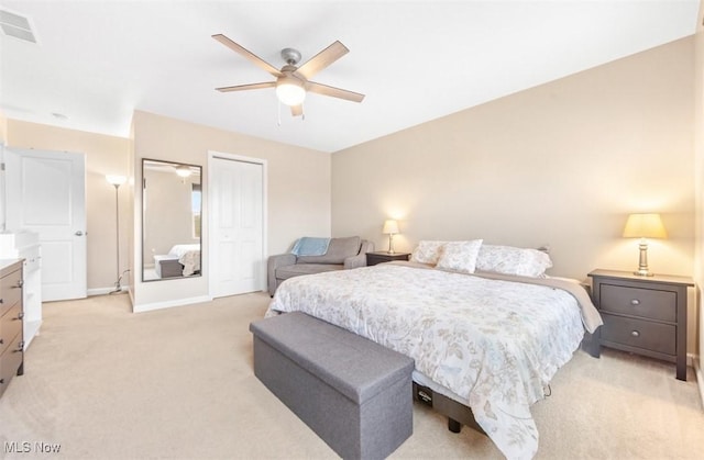 carpeted bedroom with a closet and ceiling fan