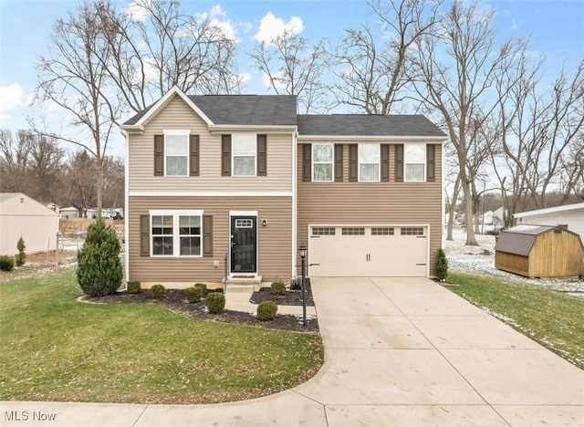 view of front of home featuring a front yard, a garage, and a storage unit