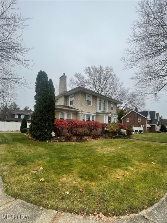 view of property exterior featuring a yard