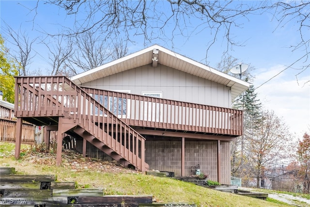 back of house featuring a deck