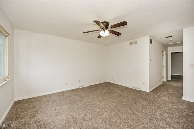 carpeted empty room featuring ceiling fan