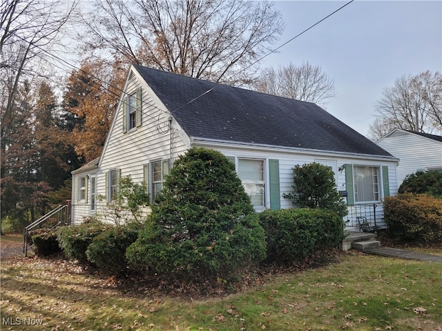 view of side of home featuring a yard