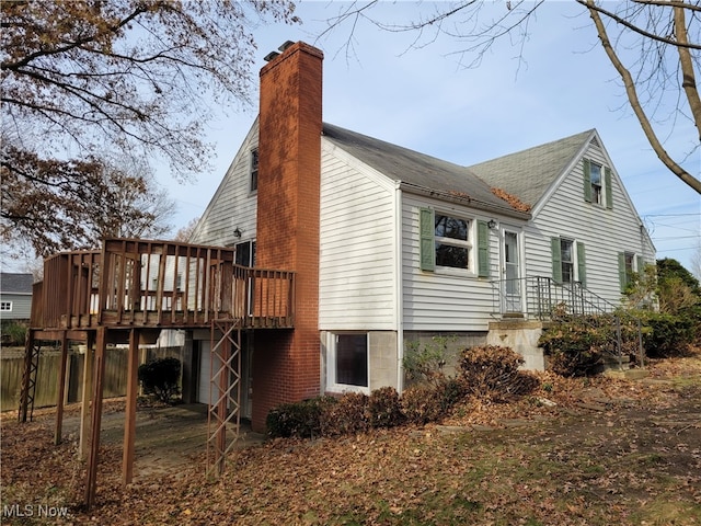 back of property featuring a deck