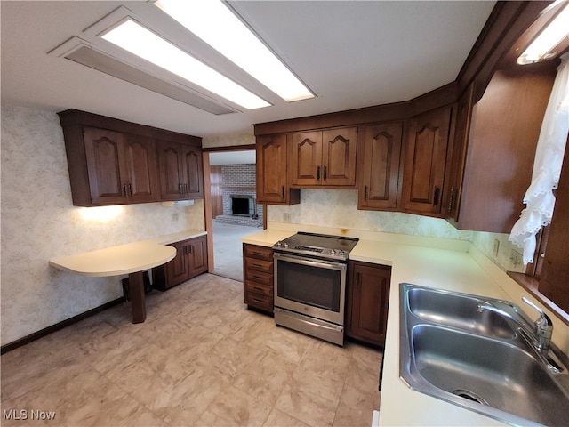 kitchen featuring electric stove and sink