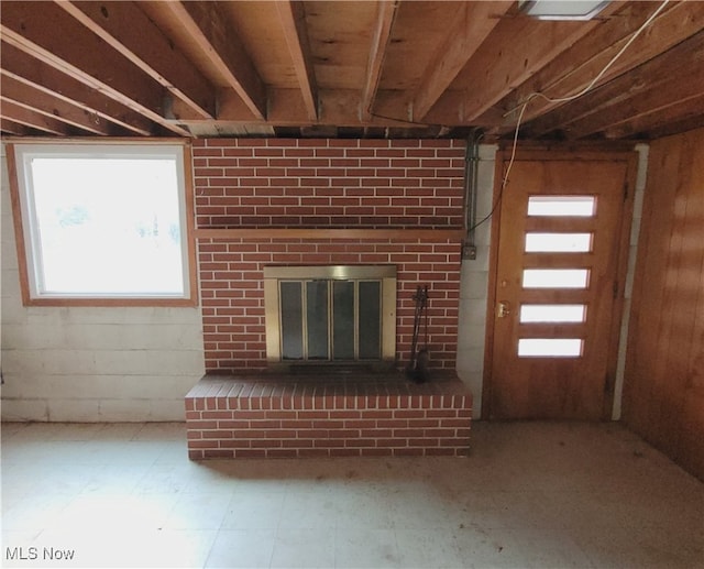 unfurnished living room featuring a fireplace