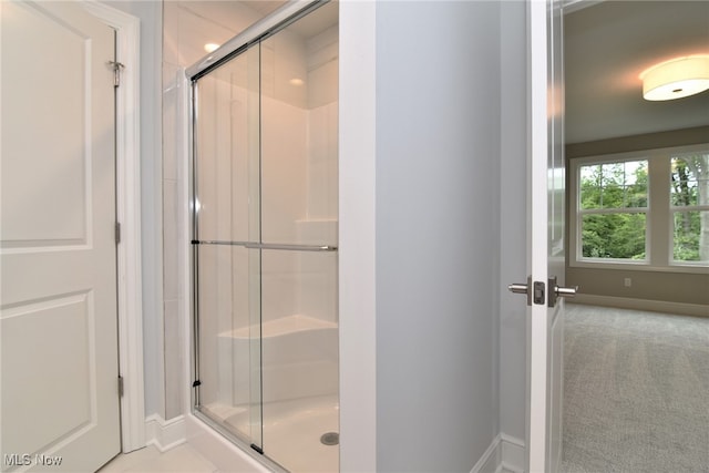 bathroom featuring an enclosed shower