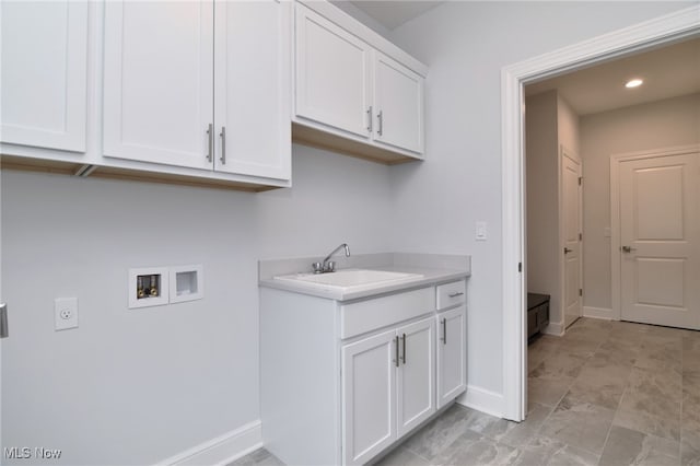 clothes washing area featuring washer hookup, hookup for an electric dryer, cabinets, and sink