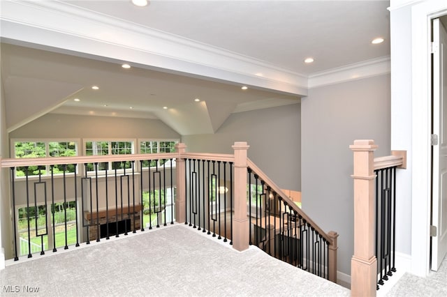 hall featuring carpet flooring and ornamental molding