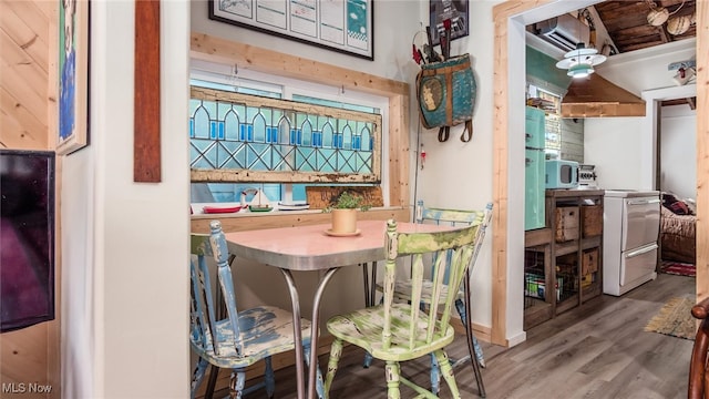 dining space featuring wood-type flooring