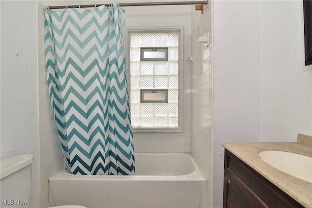 full bathroom with vanity, toilet, and shower / bath combo with shower curtain