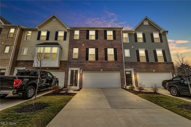 multi unit property featuring a garage