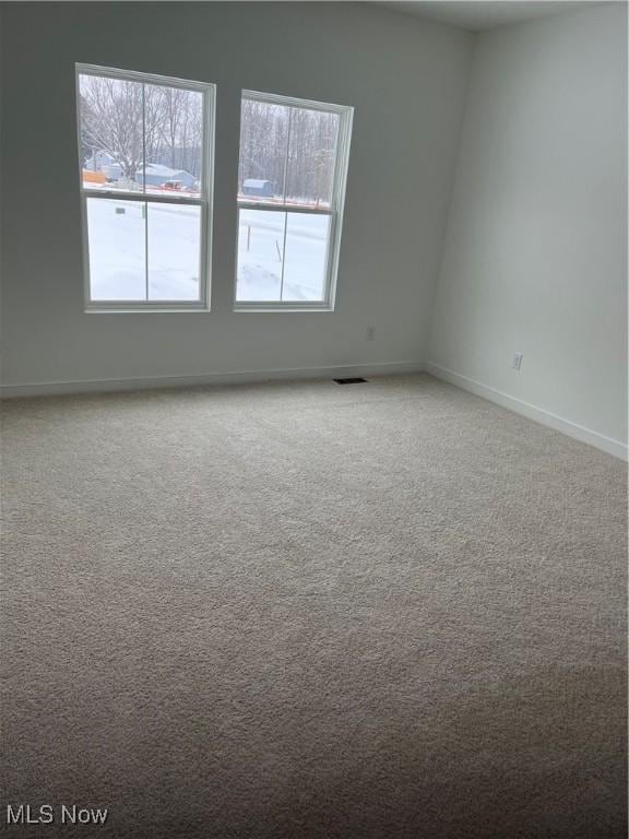 view of carpeted spare room