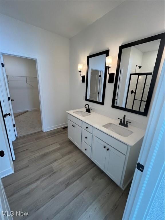 bathroom featuring vanity and hardwood / wood-style flooring