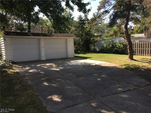 garage featuring a yard