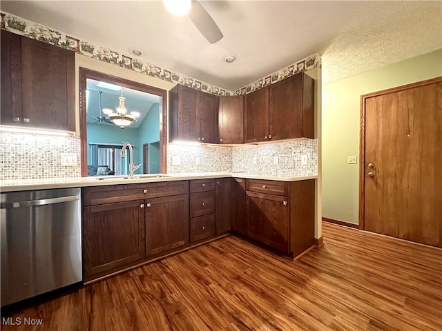 kitchen with decorative backsplash, stainless steel dishwasher, dark brown cabinets, sink, and dark hardwood / wood-style floors