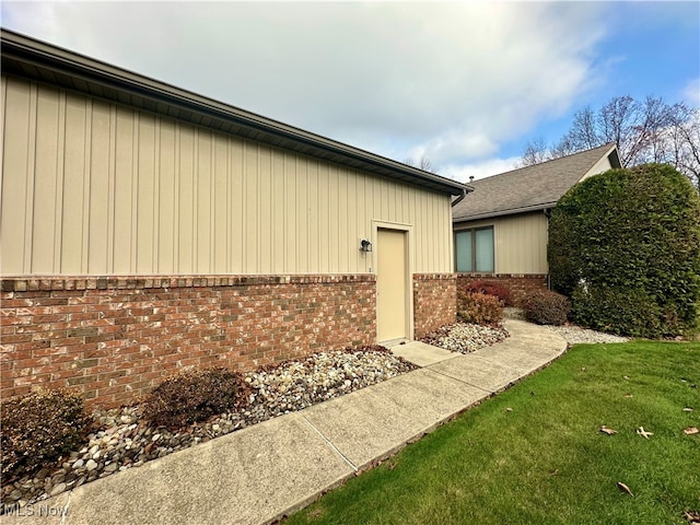 view of home's exterior featuring a yard