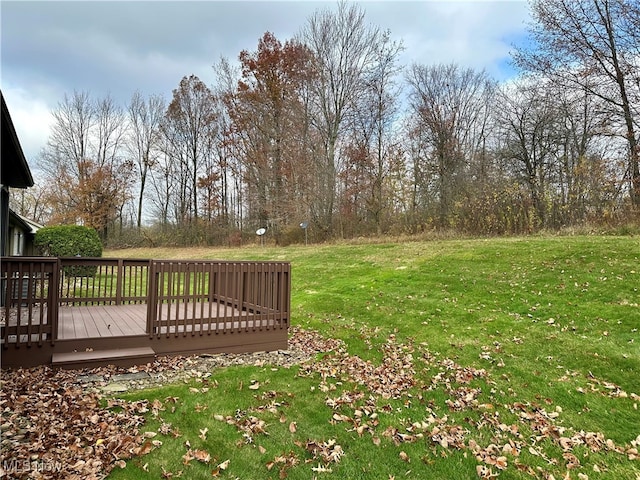 view of yard featuring a wooden deck