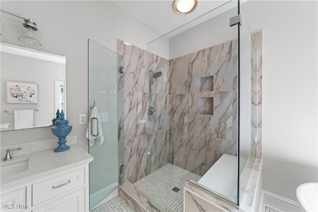 bathroom with vanity and an enclosed shower