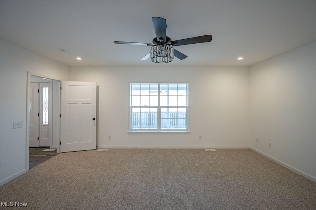 unfurnished room featuring carpet floors and ceiling fan