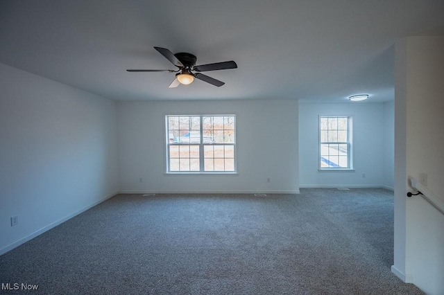 spare room featuring carpet and ceiling fan