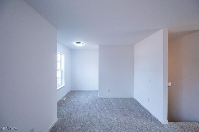 empty room featuring carpet floors