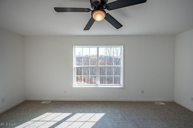 carpeted empty room with ceiling fan