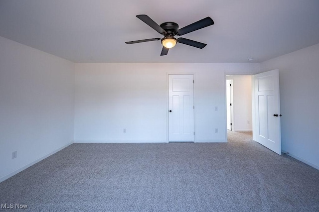 unfurnished bedroom with carpet floors and ceiling fan