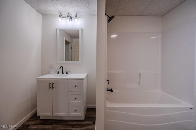 bathroom featuring hardwood / wood-style floors, vanity, and bathtub / shower combination