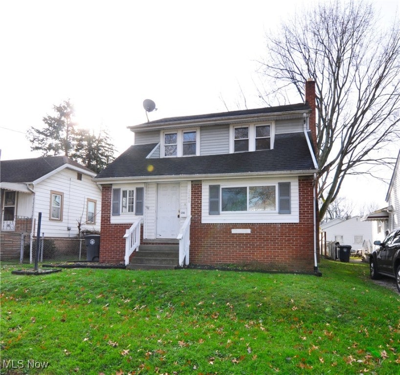 view of front of house with a front lawn