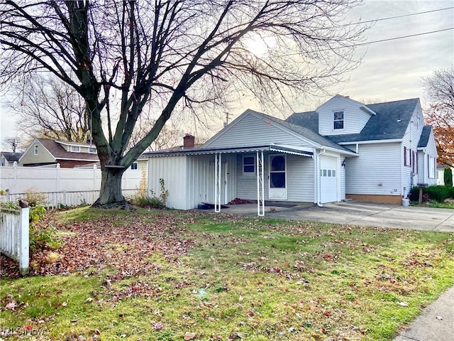 view of front of property with a garage and a front yard