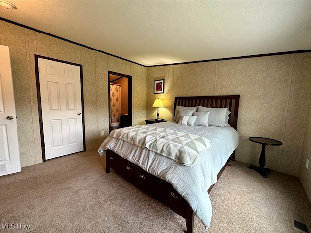 carpeted bedroom with crown molding