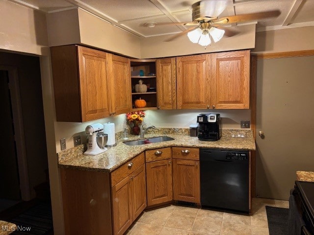 kitchen with sink, light stone counters, ceiling fan, and black appliances