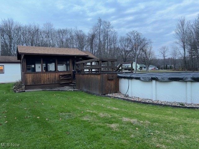 exterior space with a covered pool