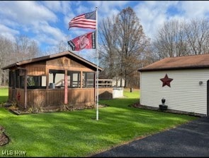 view of side of home featuring a lawn