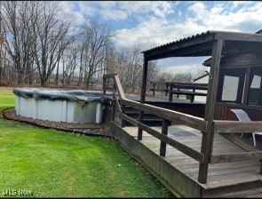 dock area featuring a yard and a pool side deck