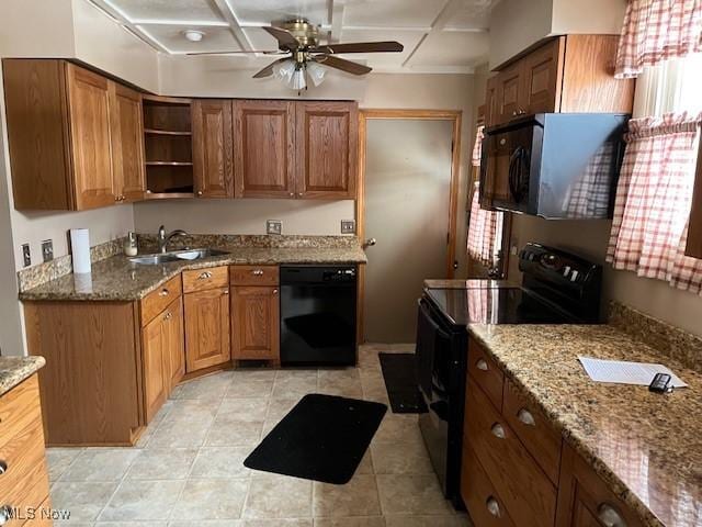 kitchen with ceiling fan, sink, black appliances, light tile patterned floors, and stone countertops