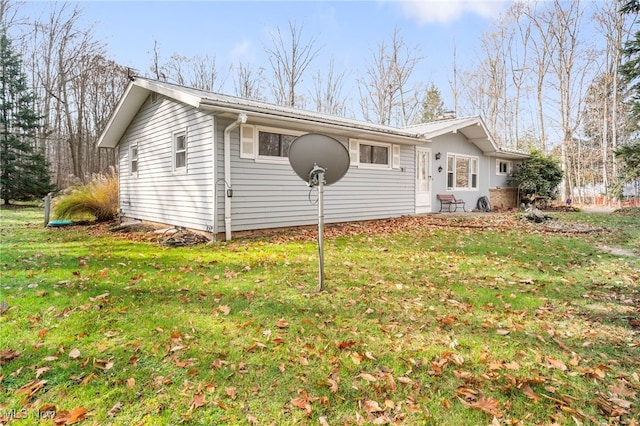 view of home's exterior featuring a yard