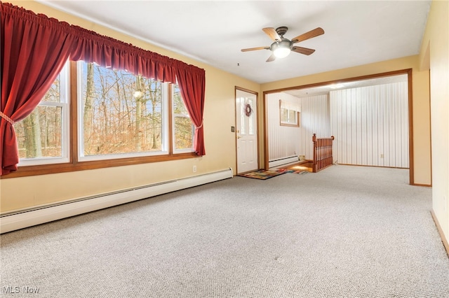 interior space with baseboard heating and ceiling fan