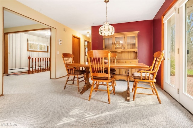 dining area with carpet and baseboard heating