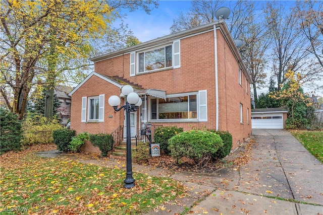 front of property featuring a garage and an outdoor structure