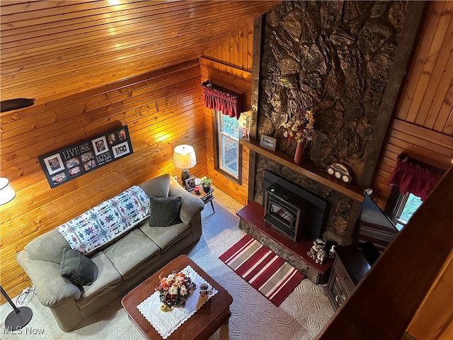 living room with wood walls, lofted ceiling, and wood ceiling