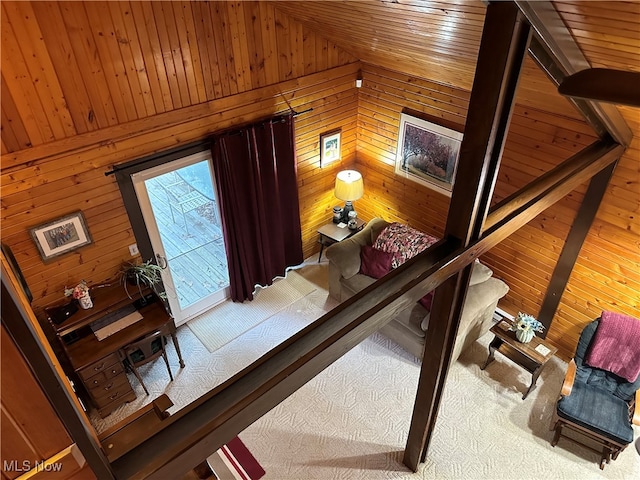 interior space featuring wood walls, wooden ceiling, and vaulted ceiling