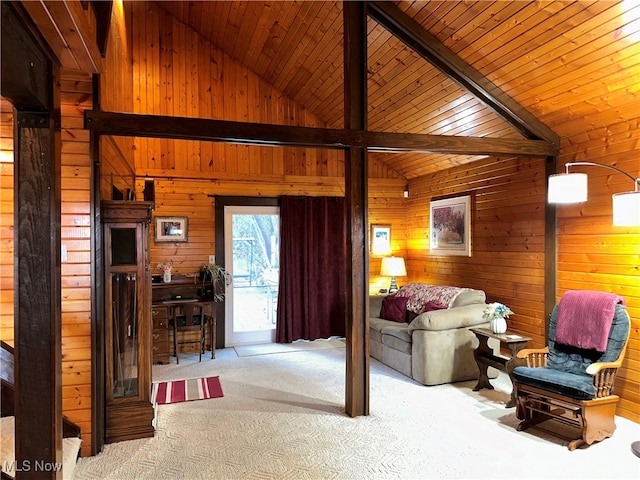 carpeted living room with beamed ceiling, wood walls, wood ceiling, and high vaulted ceiling