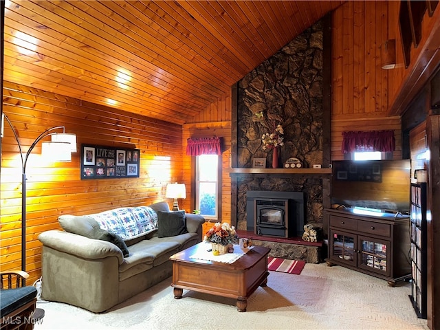 living room featuring wooden walls, a healthy amount of sunlight, lofted ceiling, and wood ceiling