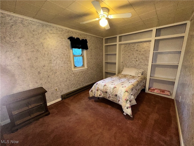 carpeted bedroom with baseboard heating, ceiling fan, and ornamental molding