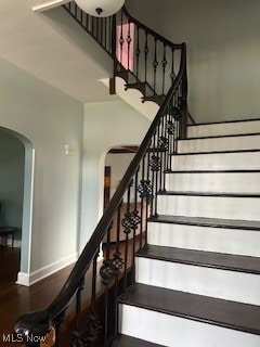 stairway featuring hardwood / wood-style floors